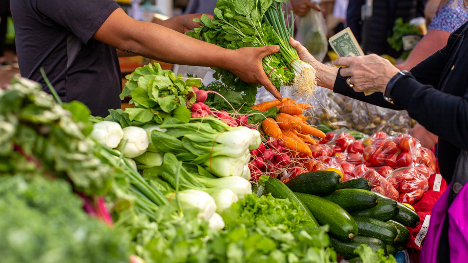 Customer pays for market produce