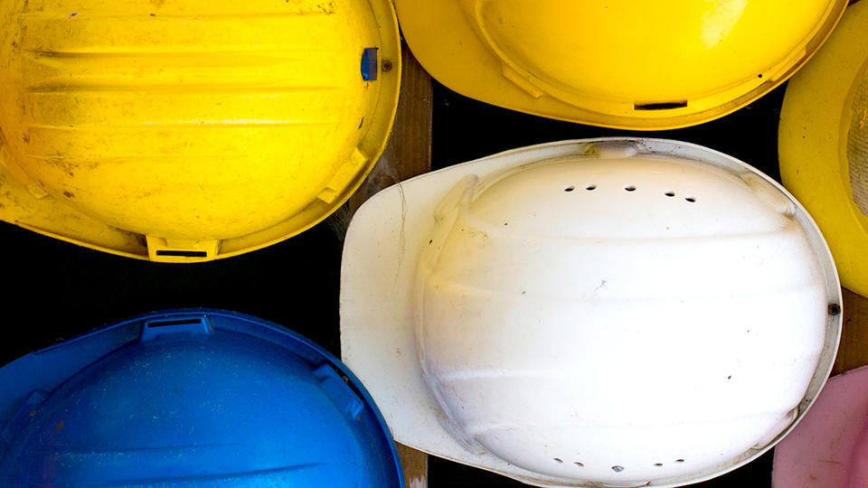 Photo of hardhats taken from above. 